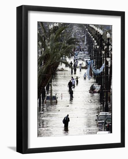 Residents Walk Through Floodwaters on Canal Street-null-Framed Photographic Print