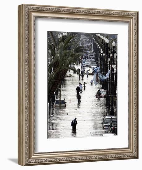 Residents Walk Through Floodwaters on Canal Street-null-Framed Photographic Print