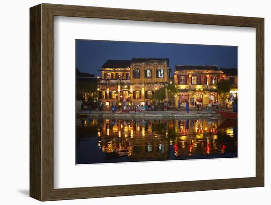 Restaurants and tourists reflected in Thu Bon River at dusk, Hoi An, Vietnam-David Wall-Framed Photographic Print