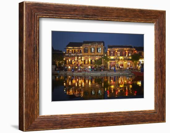 Restaurants and tourists reflected in Thu Bon River at dusk, Hoi An, Vietnam-David Wall-Framed Photographic Print