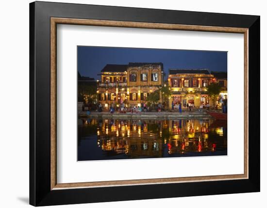 Restaurants and tourists reflected in Thu Bon River at dusk, Hoi An, Vietnam-David Wall-Framed Photographic Print