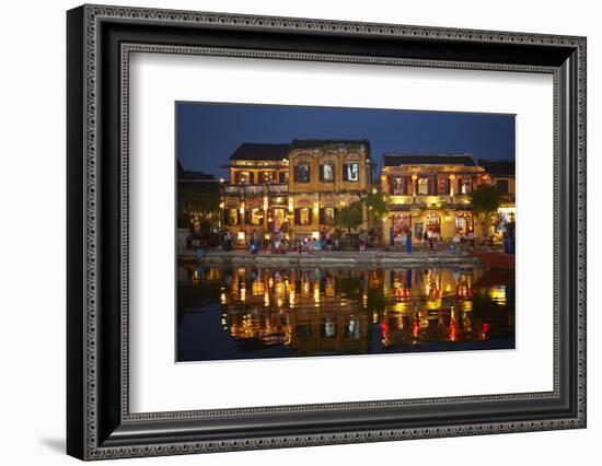 Restaurants and tourists reflected in Thu Bon River at dusk, Hoi An, Vietnam-David Wall-Framed Photographic Print