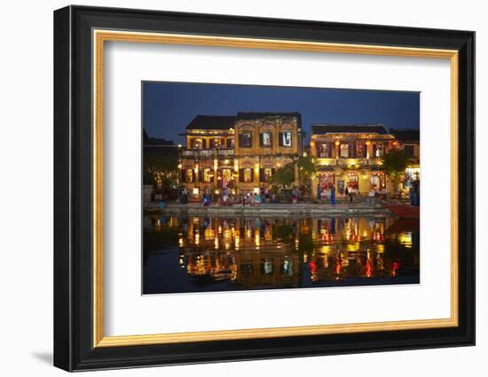 Restaurants and tourists reflected in Thu Bon River at dusk, Hoi An, Vietnam-David Wall-Framed Photographic Print