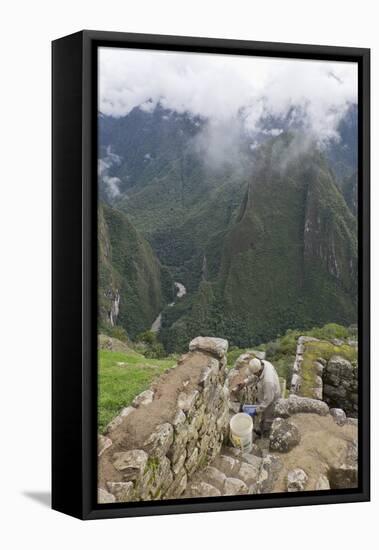 Restoration work at the Inca ruins of Machu Picchu, UNESCO World Heritage Site, Peru, South America-Julio Etchart-Framed Premier Image Canvas