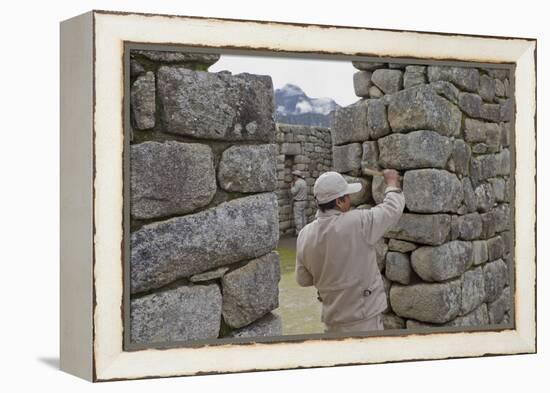 Restoration work at the Inca ruins of Machu Picchu, UNESCO World Heritage Site, Peru, South America-Julio Etchart-Framed Premier Image Canvas