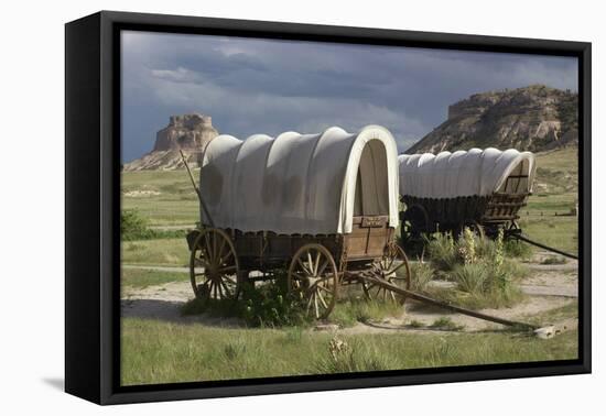 Restored Covered Wagons (Conestoga Wagon at Rear), at Scotts Bluff on the Oregon Trail in Nebraska-null-Framed Premier Image Canvas