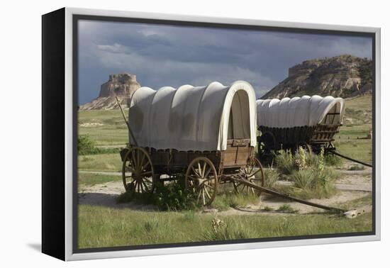 Restored Covered Wagons (Conestoga Wagon at Rear), at Scotts Bluff on the Oregon Trail in Nebraska-null-Framed Premier Image Canvas