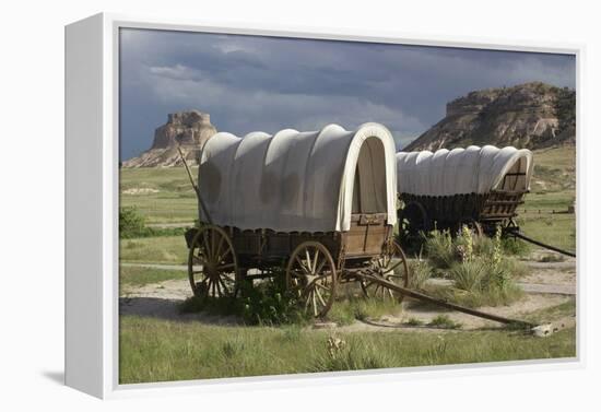 Restored Covered Wagons (Conestoga Wagon at Rear), at Scotts Bluff on the Oregon Trail in Nebraska-null-Framed Premier Image Canvas