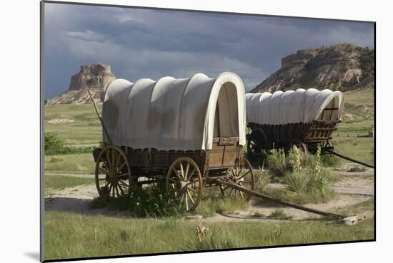 Restored Covered Wagons (Conestoga Wagon at Rear), at Scotts Bluff on the Oregon Trail in Nebraska-null-Mounted Photographic Print