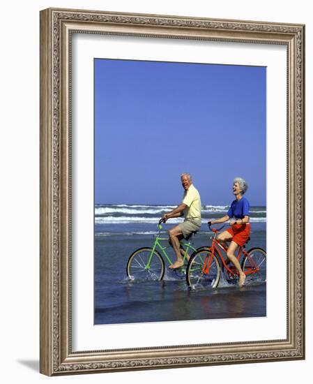 Retired Couple Riding Bikes at the Beach-Bill Bachmann-Framed Photographic Print