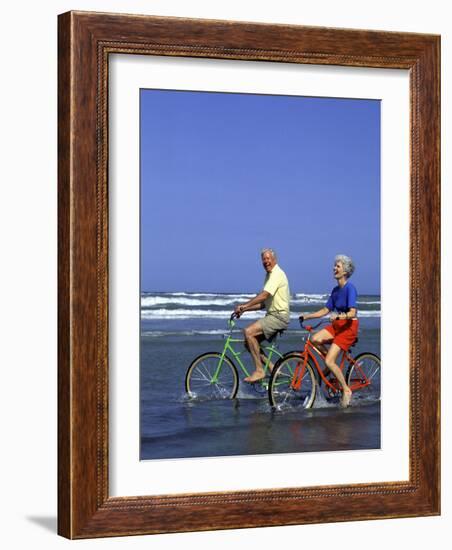 Retired Couple Riding Bikes at the Beach-Bill Bachmann-Framed Photographic Print