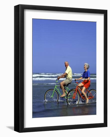 Retired Couple Riding Bikes at the Beach-Bill Bachmann-Framed Photographic Print