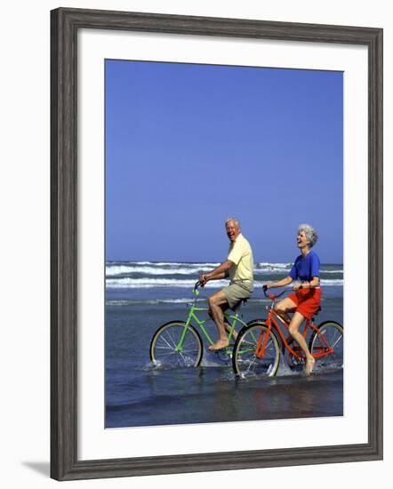 Retired Couple Riding Bikes at the Beach-Bill Bachmann-Framed Photographic Print