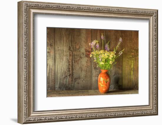 Retro Style Still Life of Dried Flowers in Vase against Worn Wooden Background-Veneratio-Framed Photographic Print