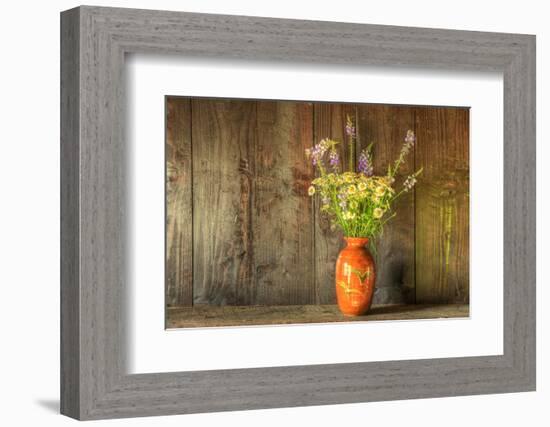 Retro Style Still Life of Dried Flowers in Vase against Worn Wooden Background-Veneratio-Framed Photographic Print