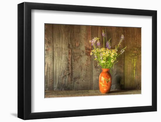Retro Style Still Life of Dried Flowers in Vase against Worn Wooden Background-Veneratio-Framed Photographic Print