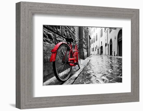 Retro Vintage Red Bike on Cobblestone Street in the Old Town. Color in Black and White. Old Charmin-Michal Bednarek-Framed Photographic Print