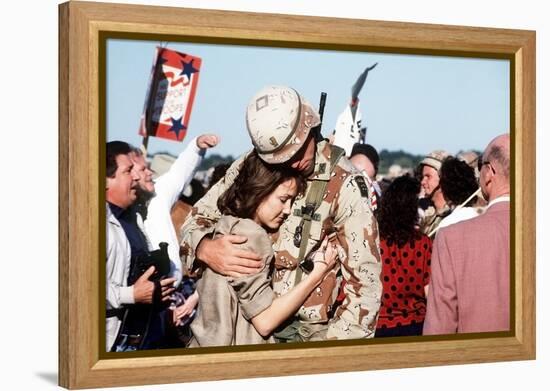 Returning US Soldier Hugs Loved One Amid Other Celebrating Families and Friends-null-Framed Stretched Canvas