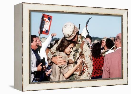 Returning US Soldier Hugs Loved One Amid Other Celebrating Families and Friends-null-Framed Stretched Canvas