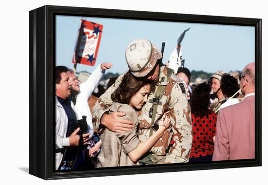 Returning US Soldier Hugs Loved One Amid Other Celebrating Families and Friends-null-Framed Stretched Canvas