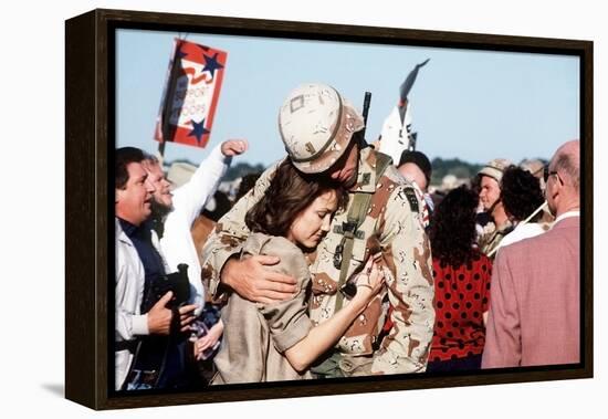 Returning US Soldier Hugs Loved One Amid Other Celebrating Families and Friends-null-Framed Stretched Canvas