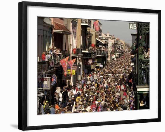 Revelers Pack the French Quarter's Famous Bourbon Street During the Annual Mardi Gras Celebration-null-Framed Photographic Print