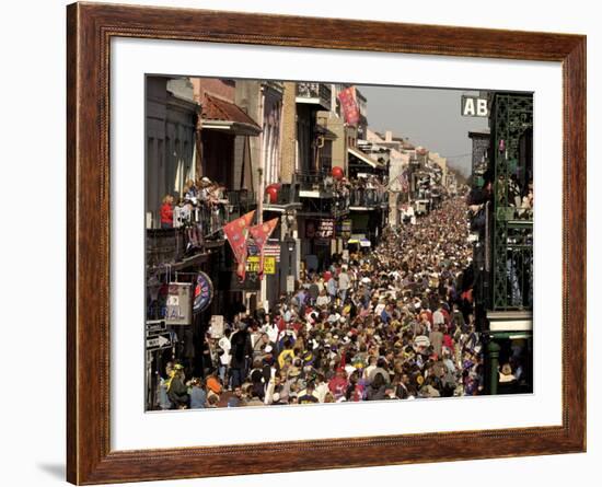 Revelers Pack the French Quarter's Famous Bourbon Street During the Annual Mardi Gras Celebration-null-Framed Photographic Print