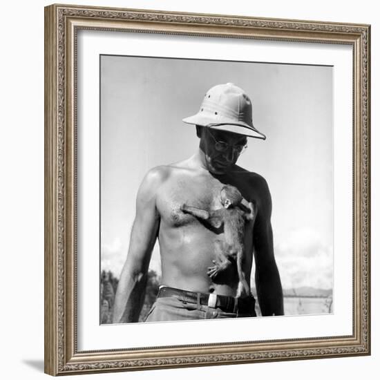 Rhesus Monkey Climbing on a Man's Chest at a Monkey Colony-Hansel Mieth-Framed Premium Photographic Print