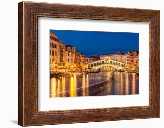 Rialto Bridge (Ponte di Rialto) at night with boat light trails on the Grand Canal, Venice, Veneto-Neale Clark-Framed Photographic Print