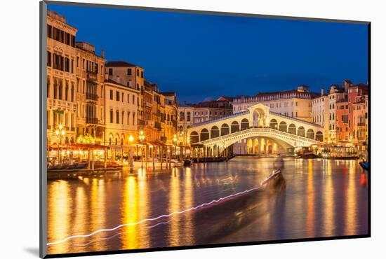 Rialto Bridge (Ponte di Rialto) at night with boat light trails on the Grand Canal, Venice, Veneto-Neale Clark-Mounted Photographic Print