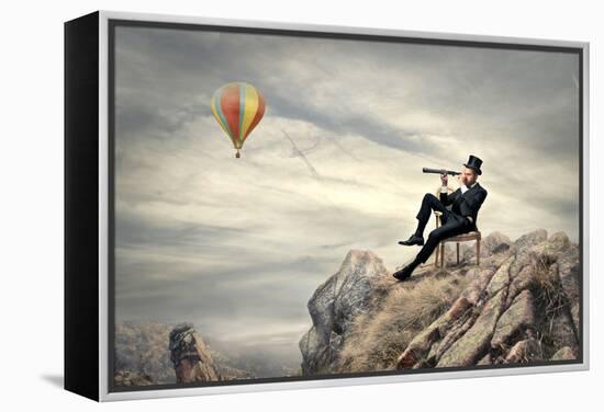 Rich Businessman Sitting On A Chair In The Mountain Looking The Landscape With Spyglass-olly2-Framed Stretched Canvas