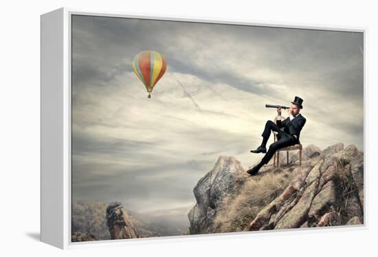 Rich Businessman Sitting On A Chair In The Mountain Looking The Landscape With Spyglass-olly2-Framed Stretched Canvas