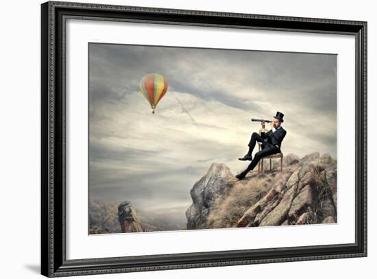 Rich Businessman Sitting On A Chair In The Mountain Looking The Landscape With Spyglass-olly2-Framed Premium Giclee Print