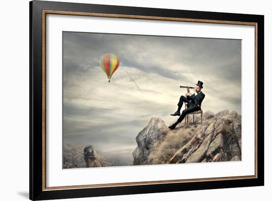 Rich Businessman Sitting On A Chair In The Mountain Looking The Landscape With Spyglass-olly2-Framed Premium Giclee Print