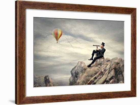 Rich Businessman Sitting On A Chair In The Mountain Looking The Landscape With Spyglass-olly2-Framed Premium Giclee Print