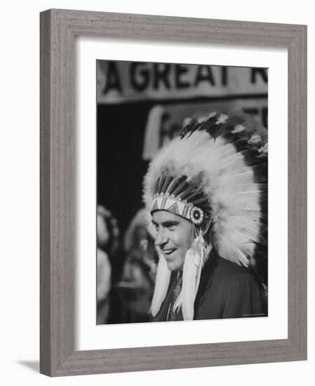 Richard M. Nixon Wearing Plains Indian Bonnet-Paul Schutzer-Framed Photographic Print
