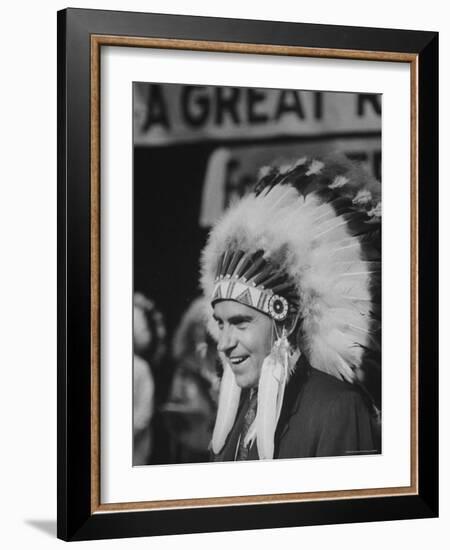 Richard M. Nixon Wearing Plains Indian Bonnet-Paul Schutzer-Framed Photographic Print