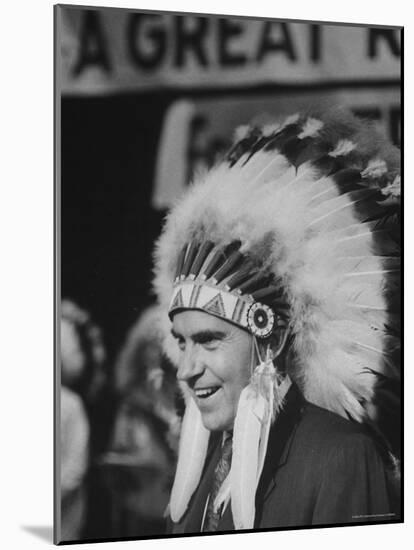 Richard M. Nixon Wearing Plains Indian Bonnet-Paul Schutzer-Mounted Photographic Print