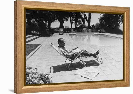 Richard Nixon Reading Newspapers While Sitting by the Pool in San Clemente, Ca. 1969-74-null-Framed Stretched Canvas