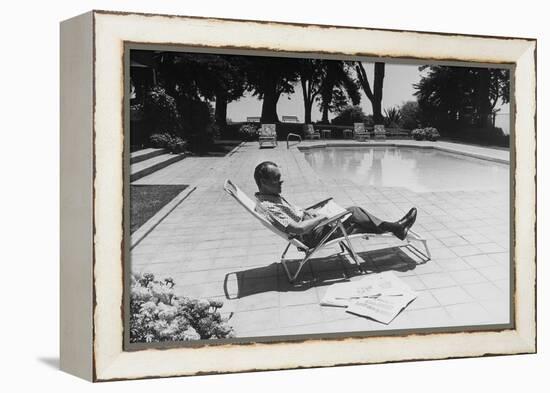 Richard Nixon Reading Newspapers While Sitting by the Pool in San Clemente, Ca. 1969-74-null-Framed Stretched Canvas