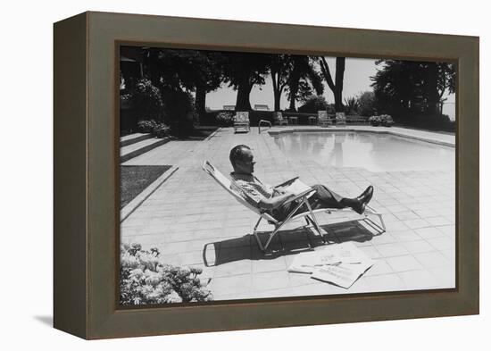 Richard Nixon Reading Newspapers While Sitting by the Pool in San Clemente, Ca. 1969-74-null-Framed Stretched Canvas