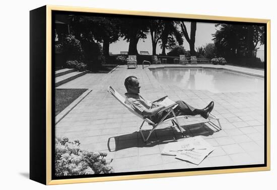 Richard Nixon Reading Newspapers While Sitting by the Pool in San Clemente, Ca. 1969-74-null-Framed Stretched Canvas