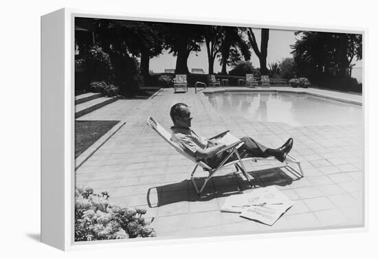 Richard Nixon Reading Newspapers While Sitting by the Pool in San Clemente, Ca. 1969-74-null-Framed Stretched Canvas