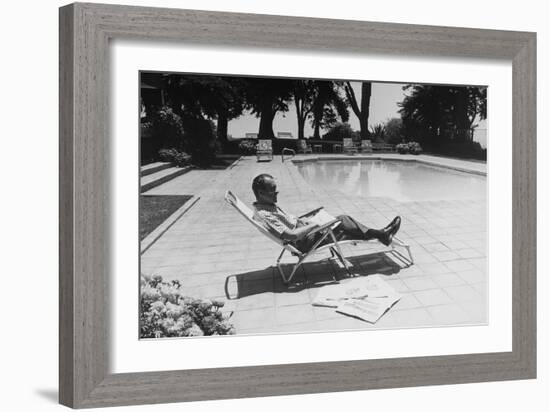 Richard Nixon Reading Newspapers While Sitting by the Pool in San Clemente, Ca. 1969-74-null-Framed Photo