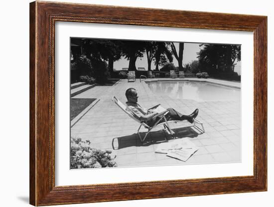 Richard Nixon Reading Newspapers While Sitting by the Pool in San Clemente, Ca. 1969-74-null-Framed Photo