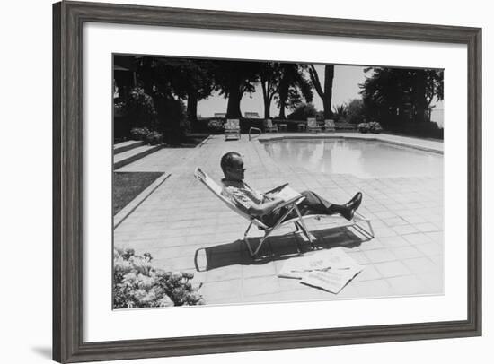 Richard Nixon Reading Newspapers While Sitting by the Pool in San Clemente, Ca. 1969-74-null-Framed Photo