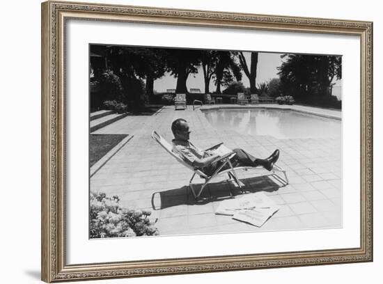 Richard Nixon Reading Newspapers While Sitting by the Pool in San Clemente, Ca. 1969-74-null-Framed Photo