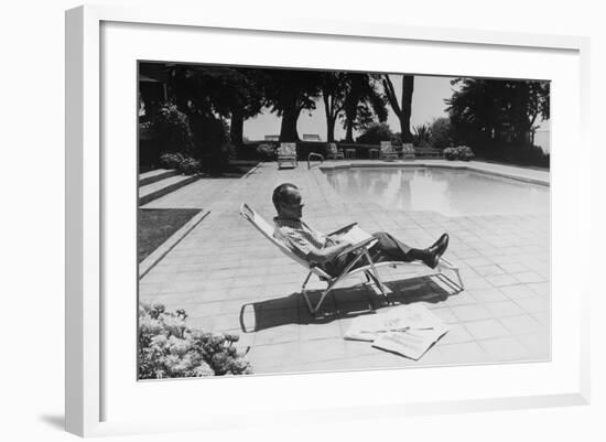 Richard Nixon Reading Newspapers While Sitting by the Pool in San Clemente, Ca. 1969-74-null-Framed Photo