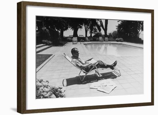 Richard Nixon Reading Newspapers While Sitting by the Pool in San Clemente, Ca. 1969-74-null-Framed Photo