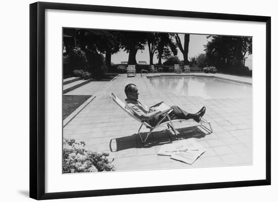 Richard Nixon Reading Newspapers While Sitting by the Pool in San Clemente, Ca. 1969-74-null-Framed Photo